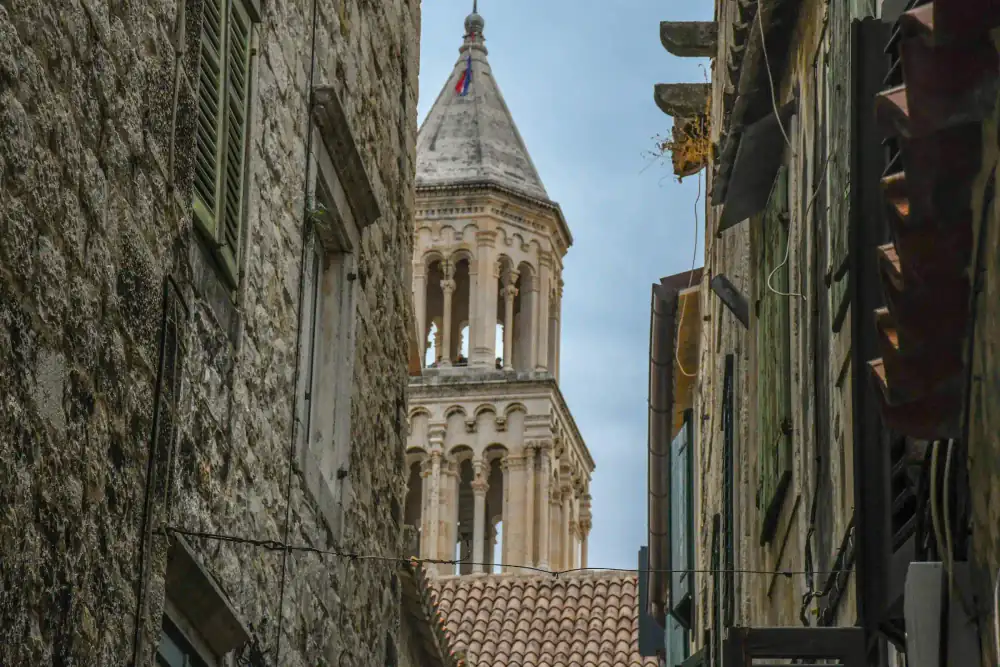 Narrow marble alley winding through Split's Old Town