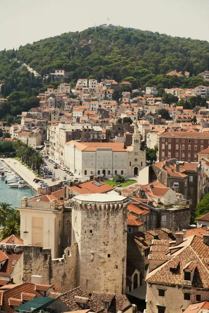 Cafés and parasols lining the palm-fringed Riva waterfront