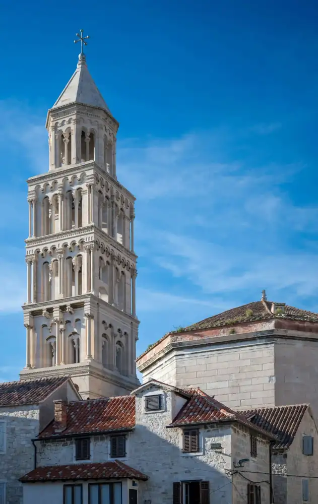 Cobbled square dotted with outdoor café tables in Split Old Town