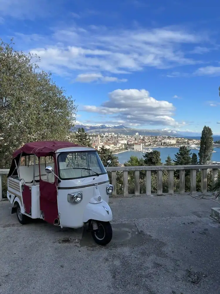 The tuk tuk threading a narrow lane of Split's historic core