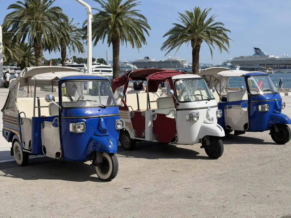 A cheerful group setting off on their Split tuk tuk adventure