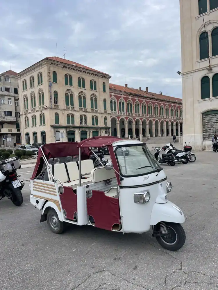 Guests capturing a selfie aboard the tuk tuk in Split